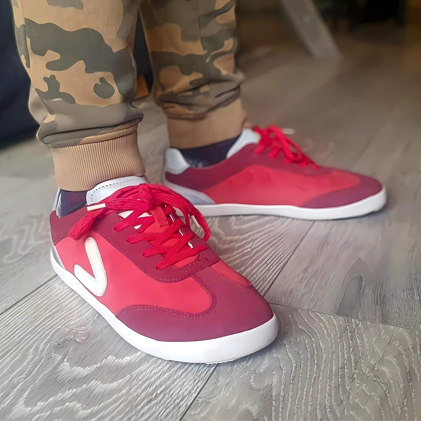 Close up of boy wearing red barefoot trainers