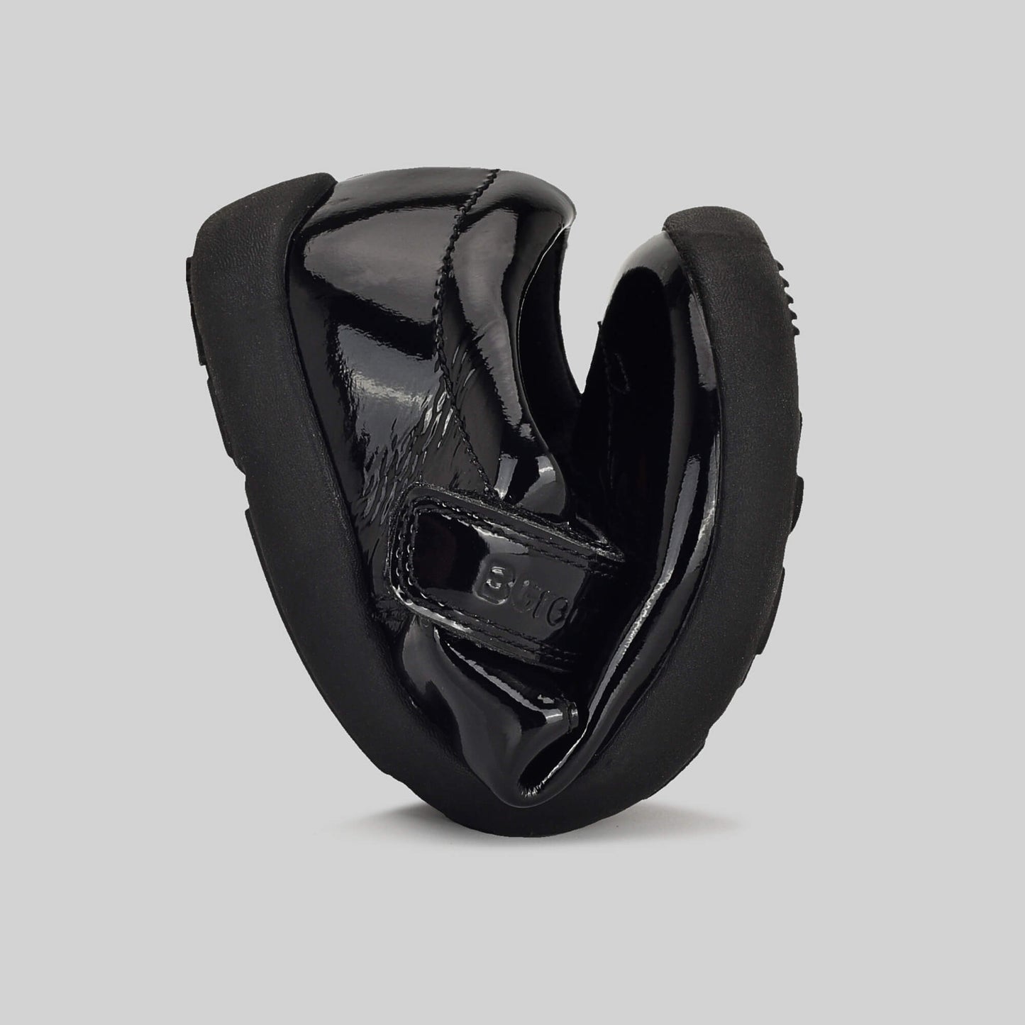 Patent black barefoot girls school shoe - flexed