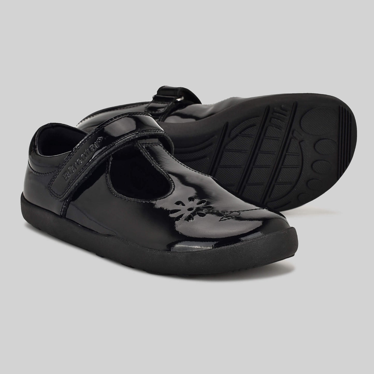 Patent black barefoot girls school shoe - pair with sole showing