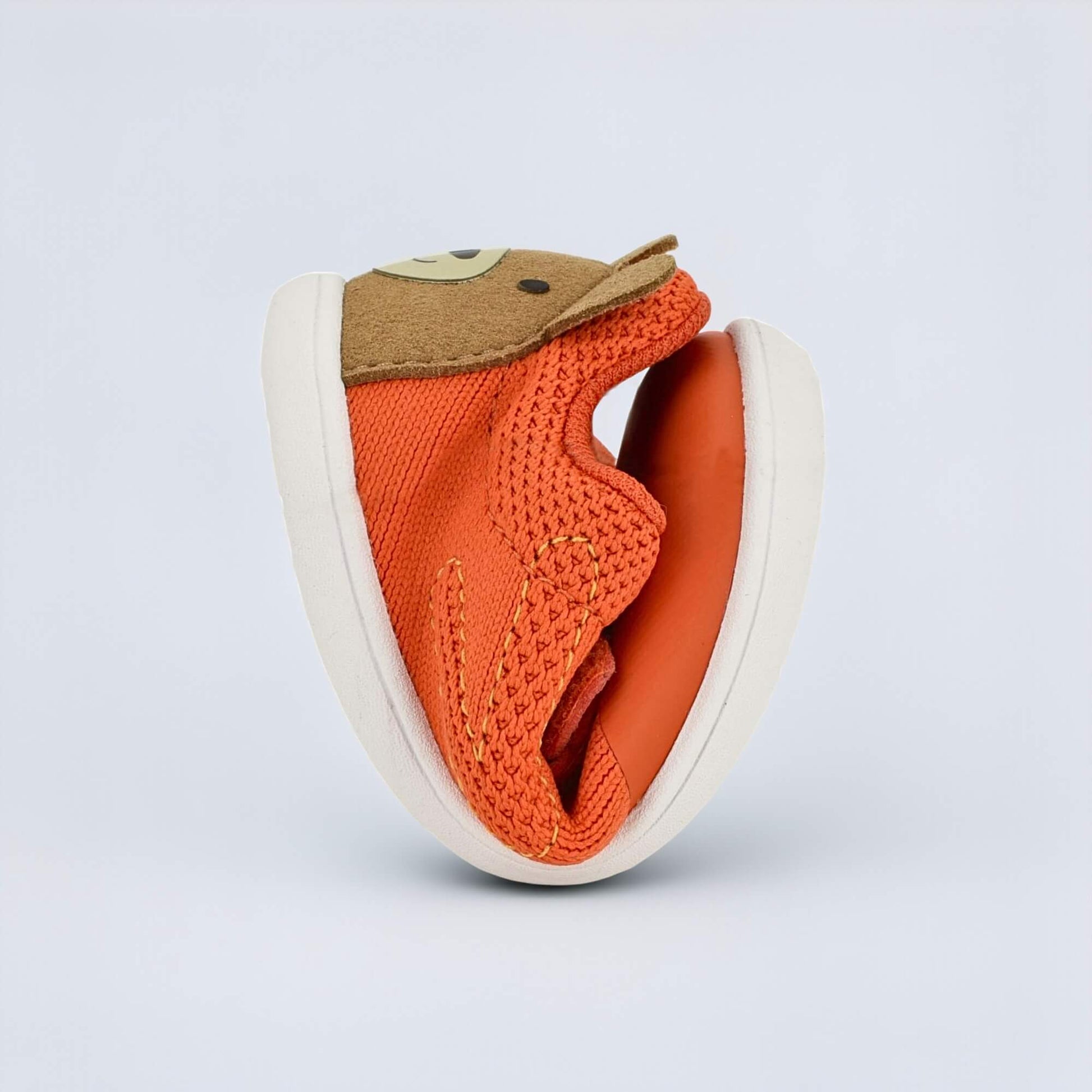 Orange barefoot toddler trainer - flexed