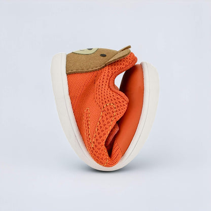 Orange barefoot toddler trainer - flexed