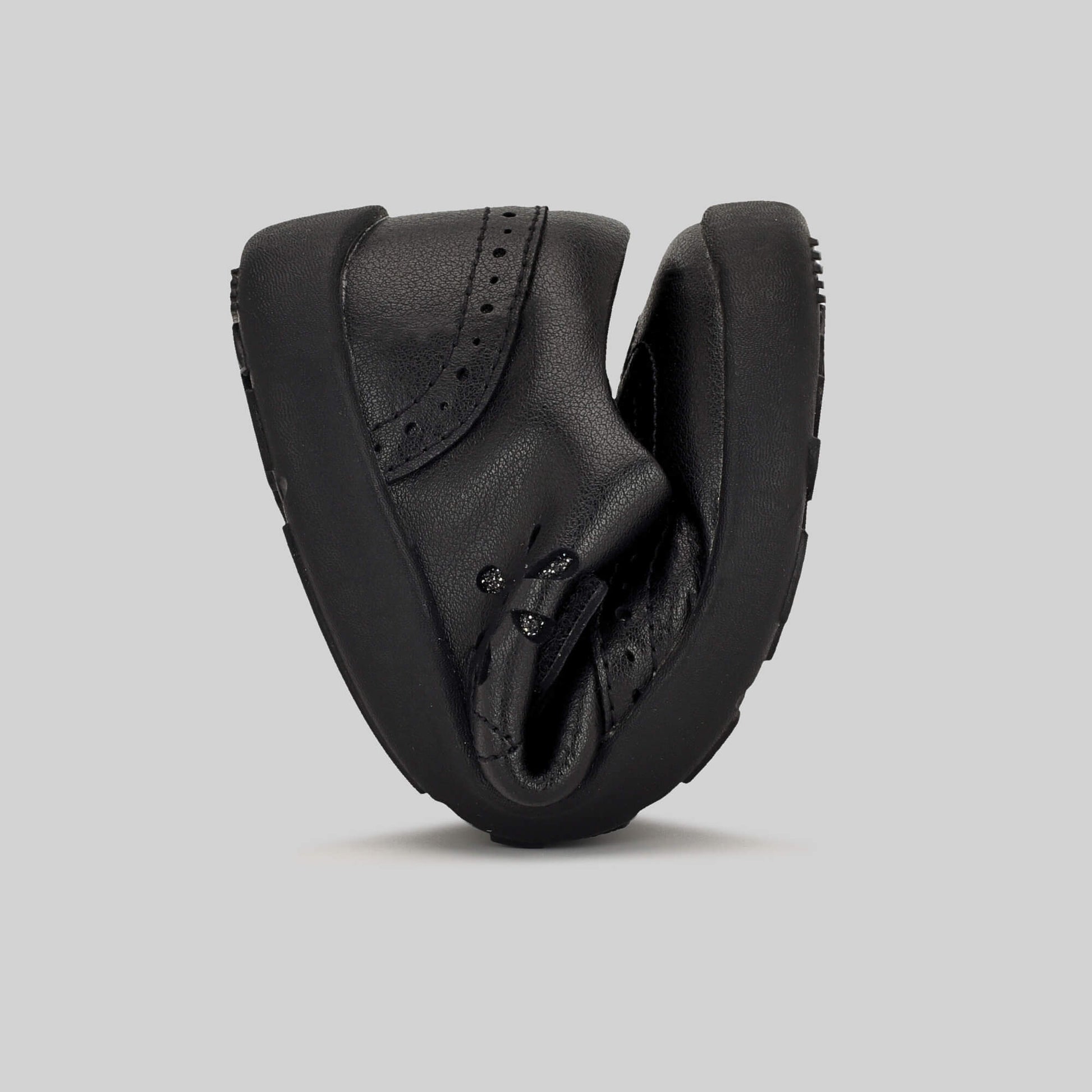 Matte black barefoot girls school shoe - flexed