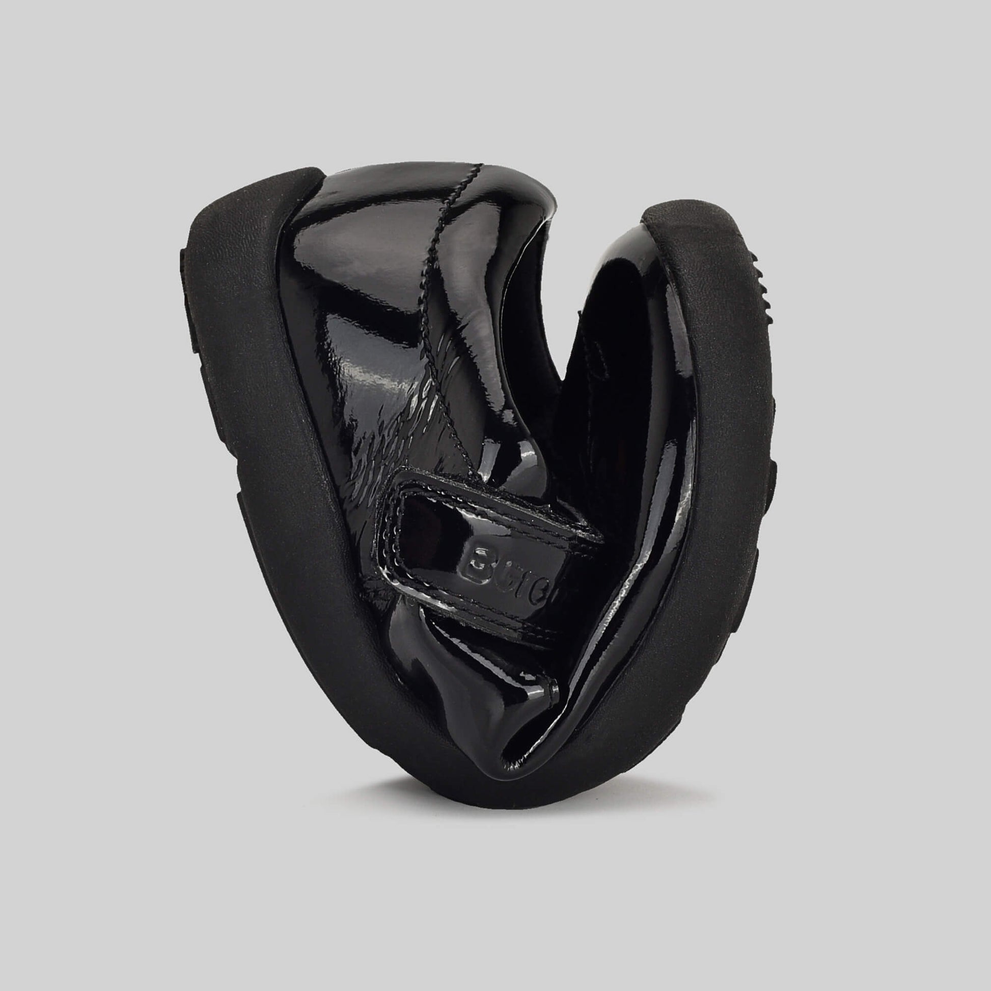 Patent black barefoot girls school shoe - flexed