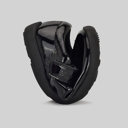 Patent black barefoot girls school shoe - flexed